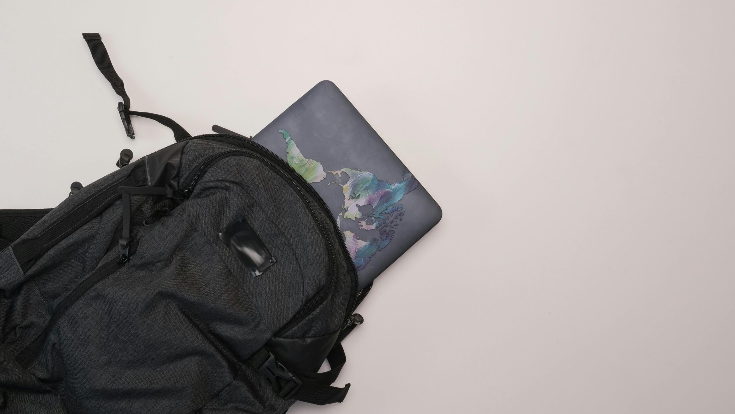 A neatly packed carry-on bag with essential items including medications and electronics