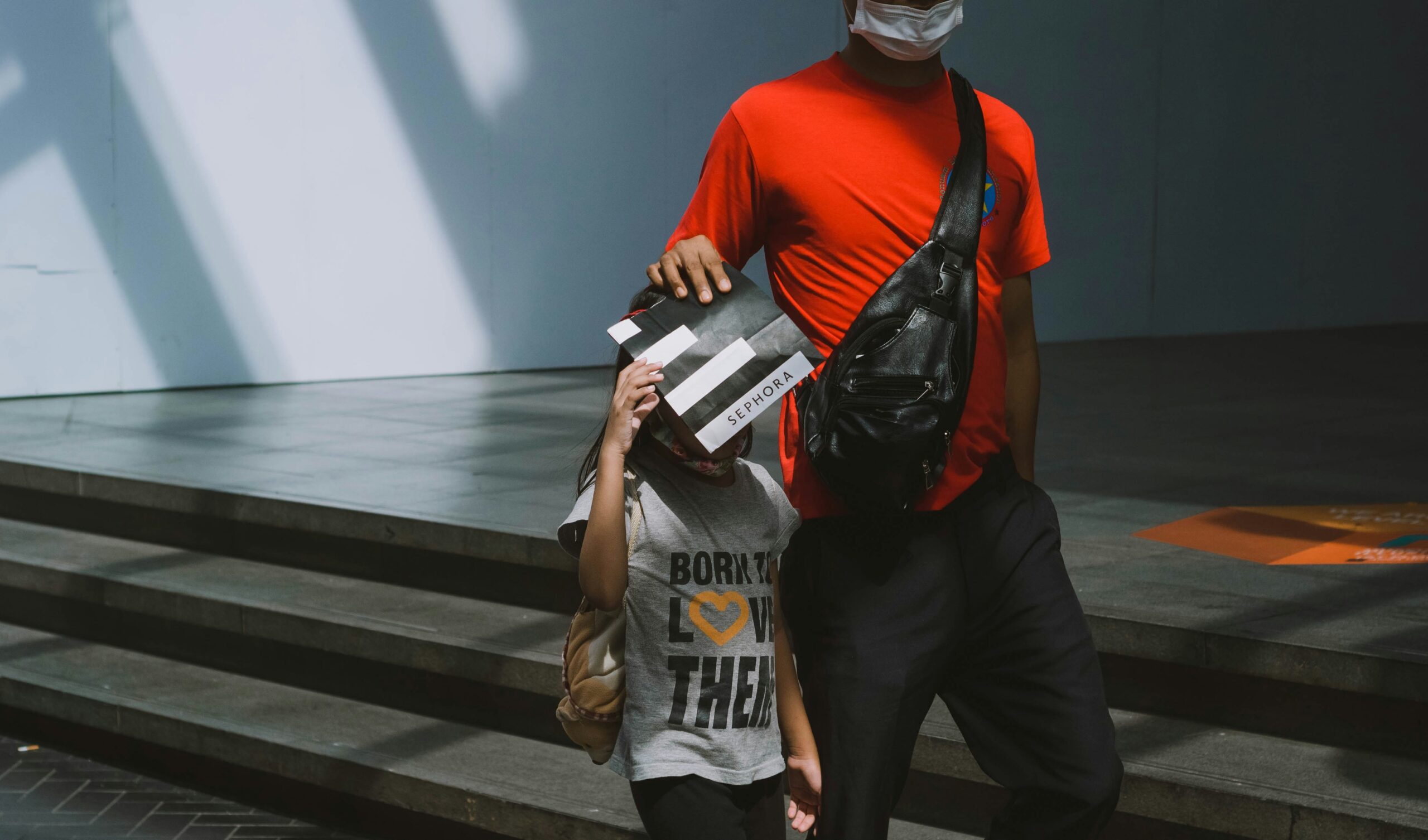 Photo of traveler holding new clothes purchased after baggage delay