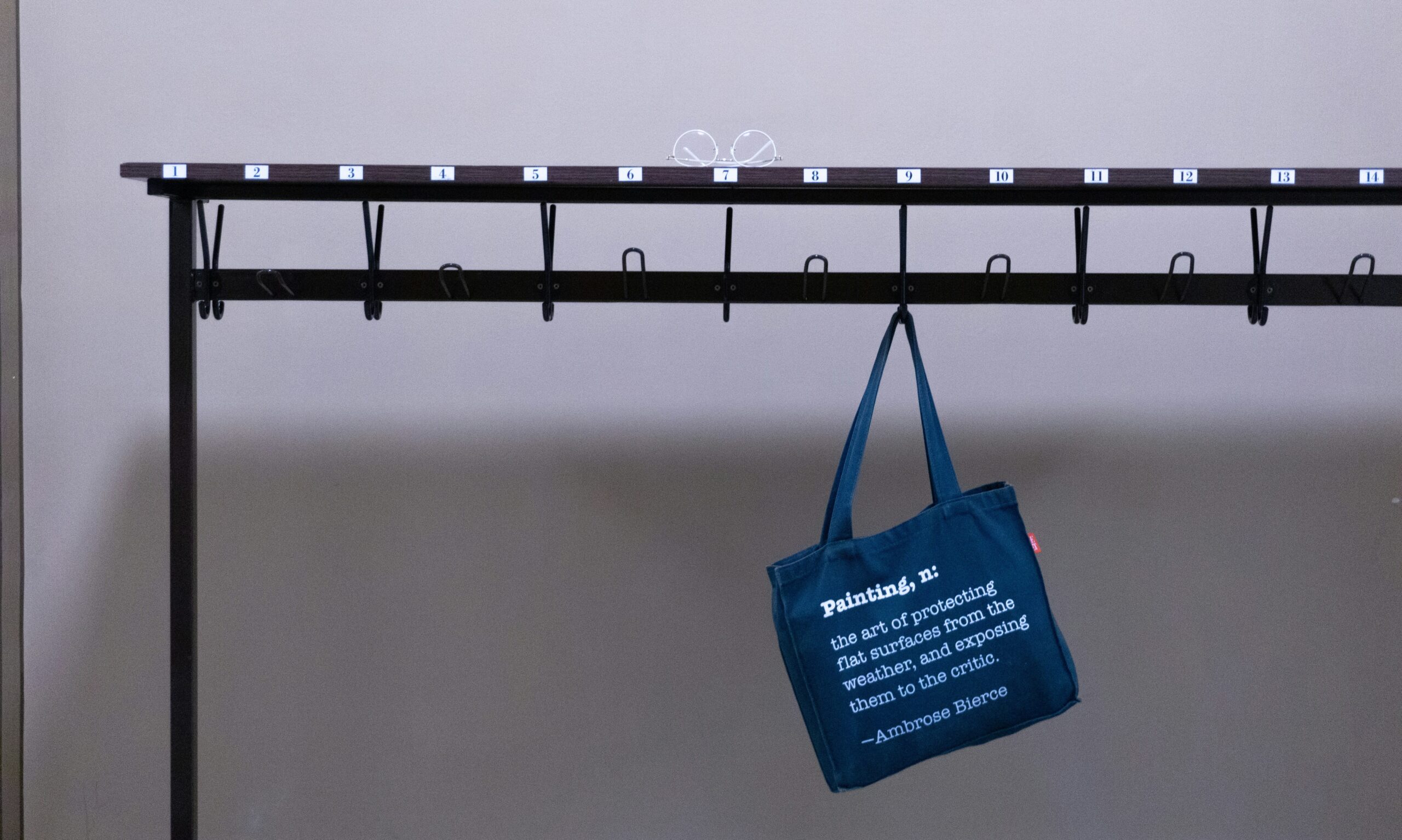 Traditional paper baggage tags hanging off airport conveyor belts