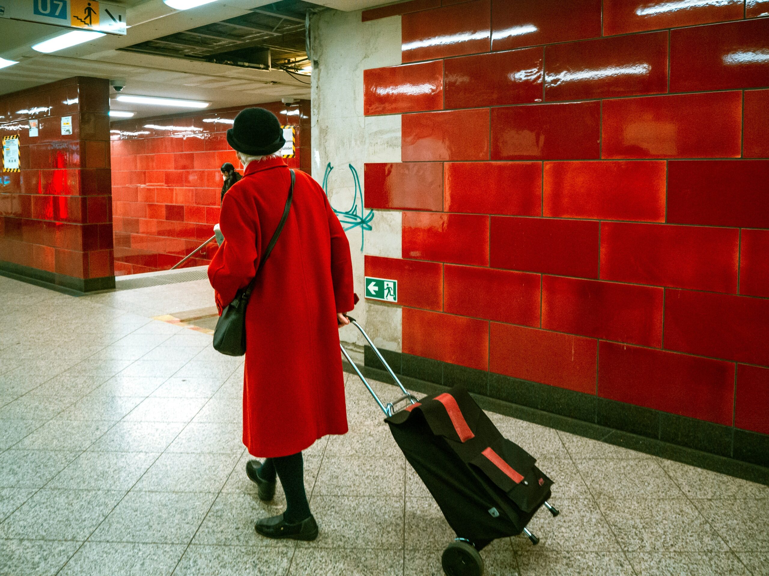 Woman holding lost suitcase found thanks to luggage locator app